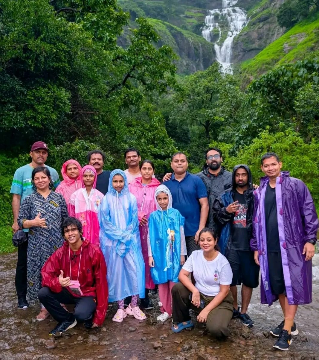 Family group enjoying Bhandardara waterfall